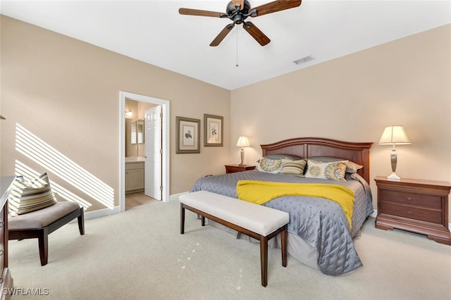 carpeted bedroom featuring ensuite bathroom and ceiling fan