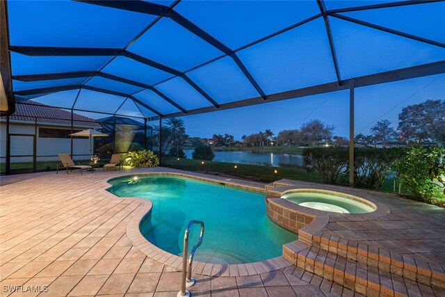 view of swimming pool with glass enclosure, an in ground hot tub, a water view, and a patio