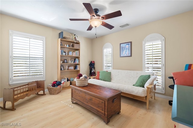 sitting room featuring ceiling fan and light hardwood / wood-style flooring