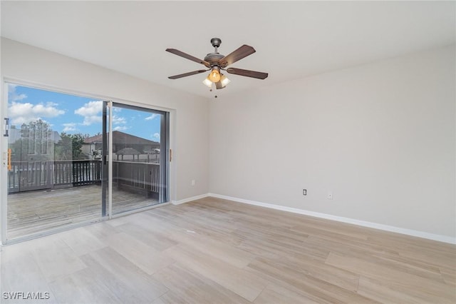 spare room featuring ceiling fan and light wood-type flooring