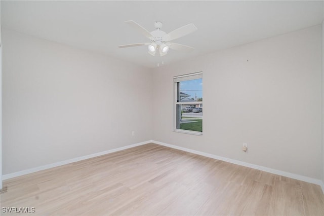 unfurnished room featuring ceiling fan and light hardwood / wood-style flooring