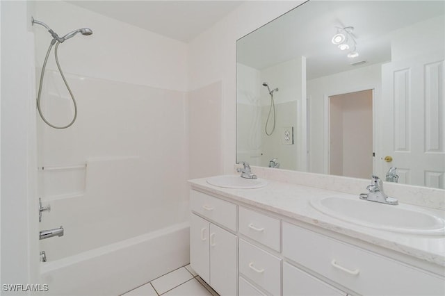 bathroom with tile patterned floors, shower / bathing tub combination, and vanity