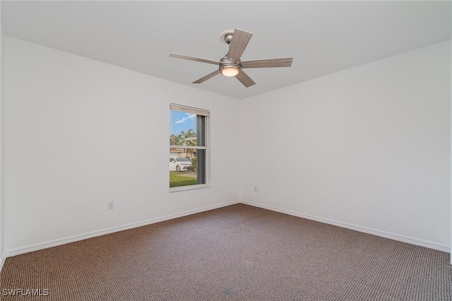 empty room featuring carpet flooring and ceiling fan