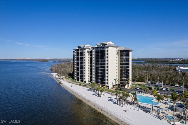 bird's eye view featuring a water view and a view of the beach