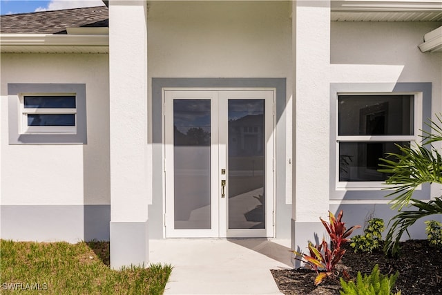 doorway to property featuring french doors