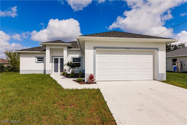 view of front facade featuring a front yard and a garage