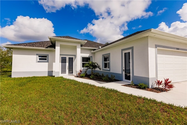 view of front facade featuring a front yard and a garage