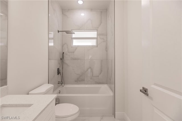 full bathroom with toilet, tiled shower / bath, and vanity