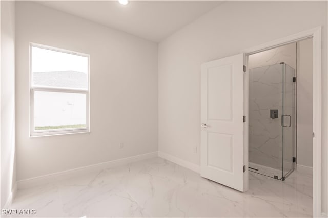 interior space featuring a wealth of natural light and an enclosed shower