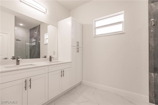 bathroom with vanity and a shower with shower door