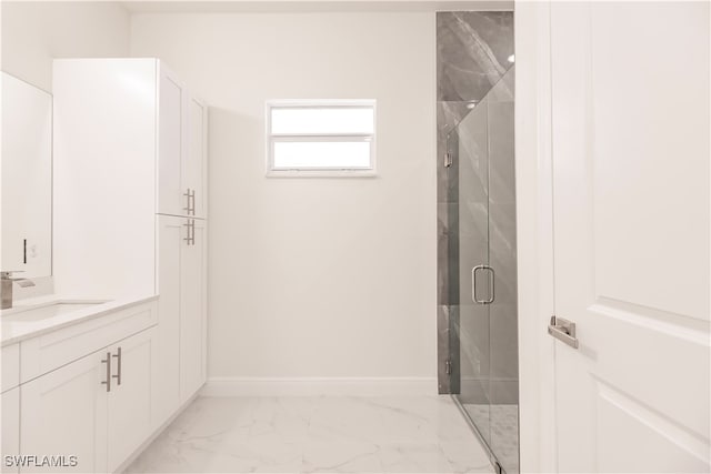 bathroom featuring vanity and an enclosed shower