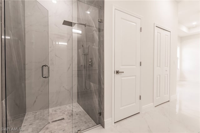 bathroom with a shower with shower door