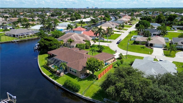 bird's eye view featuring a residential view and a water view