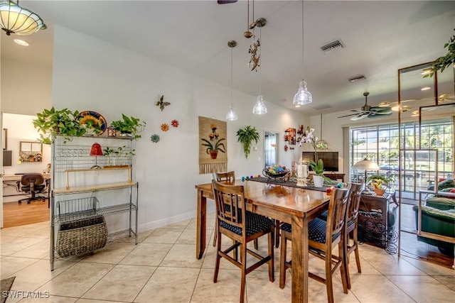 dining room featuring light tile patterned flooring, visible vents, ceiling fan, and baseboards