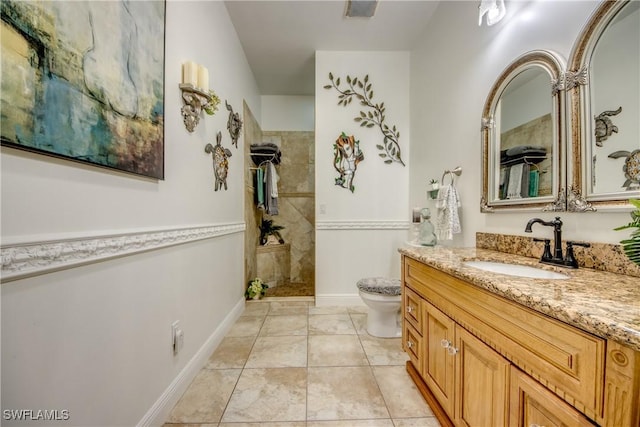 full bathroom with toilet, tile patterned flooring, baseboards, walk in shower, and vanity