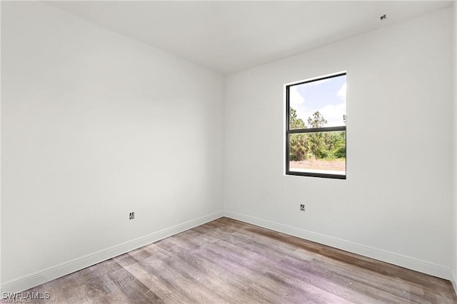 spare room with light hardwood / wood-style floors