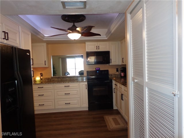 kitchen with black appliances, a raised ceiling, white cabinetry, ceiling fan, and dark hardwood / wood-style floors