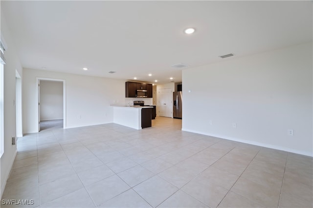 unfurnished living room with light tile patterned floors