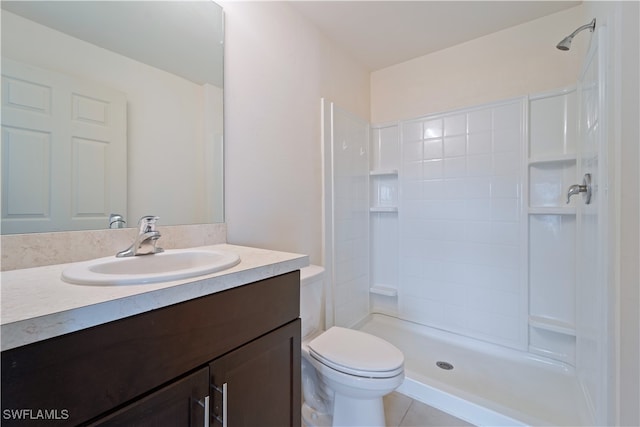 bathroom with vanity, toilet, walk in shower, and tile patterned flooring