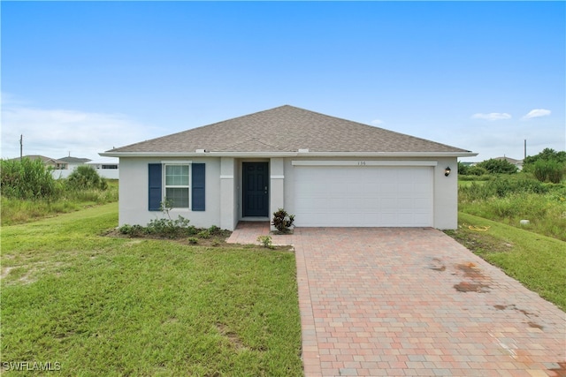 ranch-style house with a front yard and a garage