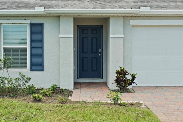 entrance to property featuring a garage