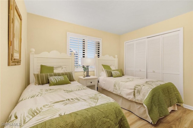 bedroom featuring a closet and hardwood / wood-style flooring