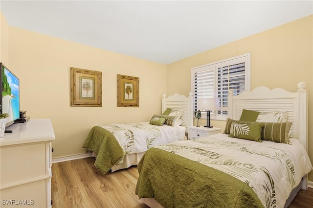 bedroom with light hardwood / wood-style floors