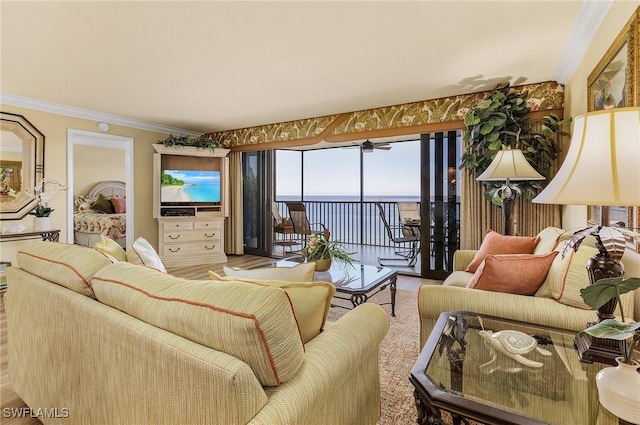 living room featuring light hardwood / wood-style floors and crown molding