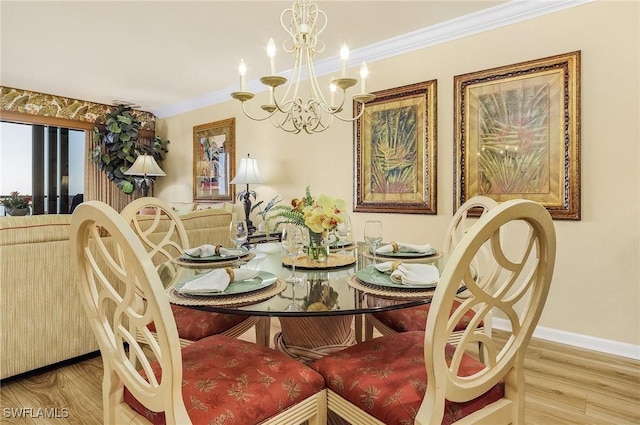 dining area featuring hardwood / wood-style flooring, crown molding, and an inviting chandelier