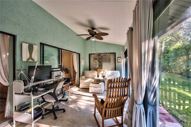 office with lofted ceiling, a textured wall, and ceiling fan