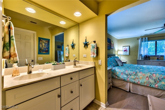 full bathroom featuring double vanity, a ceiling fan, visible vents, and a sink