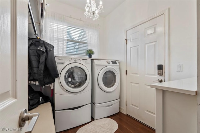 laundry area with separate washer and dryer, a chandelier, and dark hardwood / wood-style floors