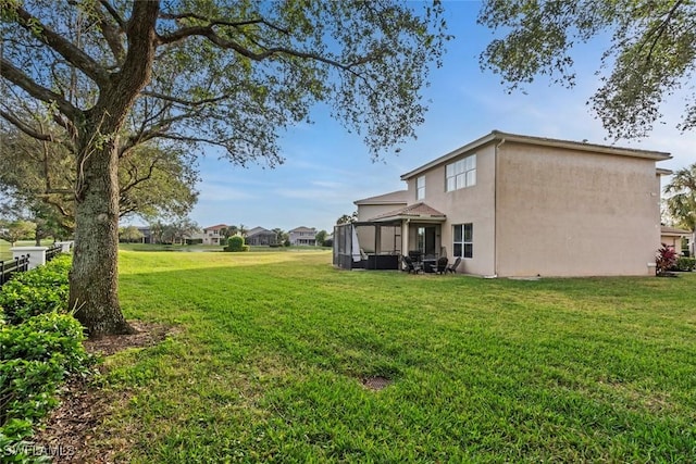 view of yard with a sunroom