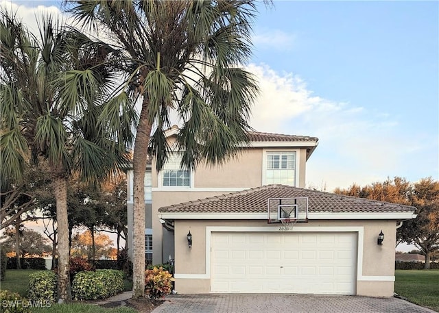 mediterranean / spanish-style home featuring a garage