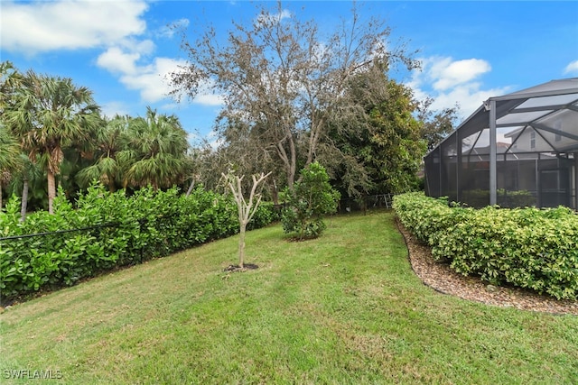 view of yard with a lanai