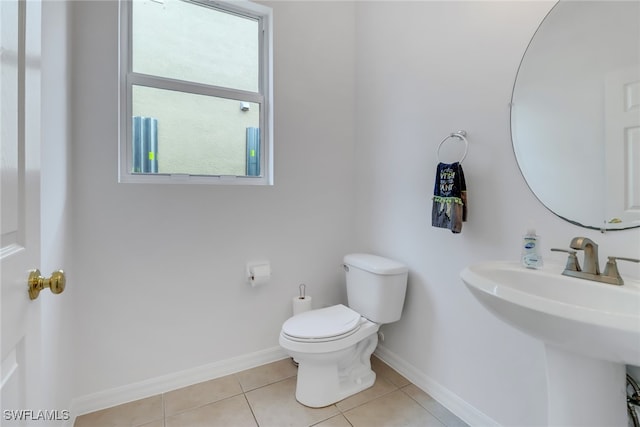 bathroom with tile patterned floors, sink, and toilet