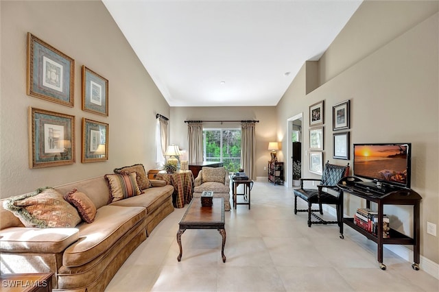 living room with high vaulted ceiling