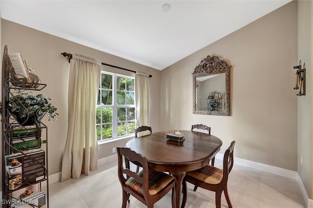 dining room with vaulted ceiling