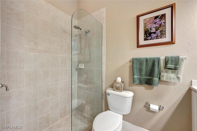 3555 Avion Woods Ct Unit 501, Naples, FL 34104 - bathroom with walk in shower, toilet, and vanity