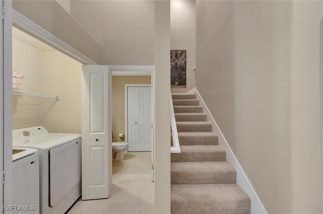 3555 Avion Woods Ct Unit 501, Naples, FL 34104 - washroom with baseboards, washer and clothes dryer, and laundry area
