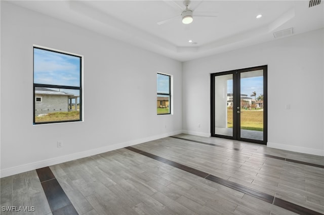 unfurnished room featuring light wood-type flooring and ceiling fan