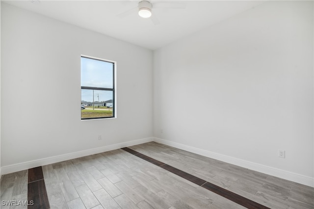 unfurnished room featuring ceiling fan and light hardwood / wood-style flooring