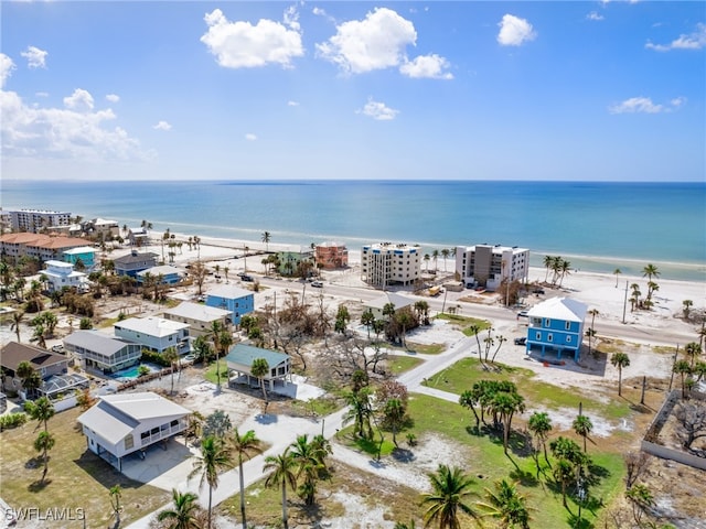 aerial view with a water view and a view of the beach