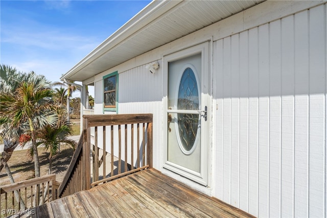 view of exterior entry featuring a deck