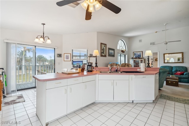 kitchen with white cabinets, light tile patterned floors, white dishwasher, pendant lighting, and sink