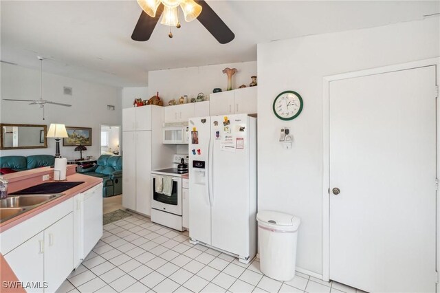 kitchen featuring white cabinets, ceiling fan, light tile patterned flooring, sink, and white appliances