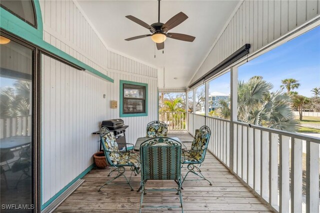 sunroom featuring ceiling fan