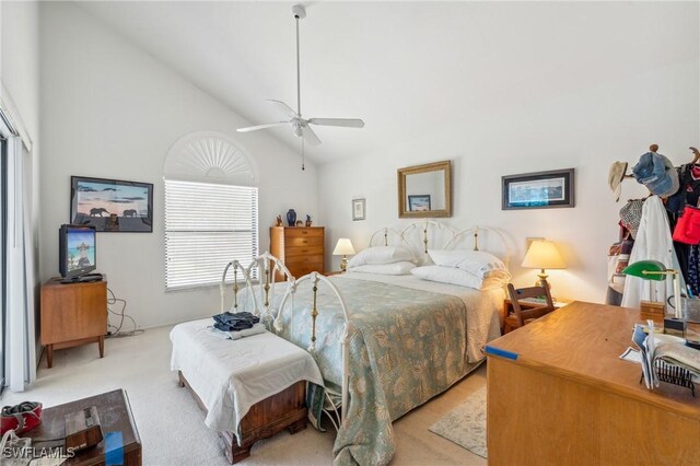 bedroom with light colored carpet, high vaulted ceiling, and ceiling fan