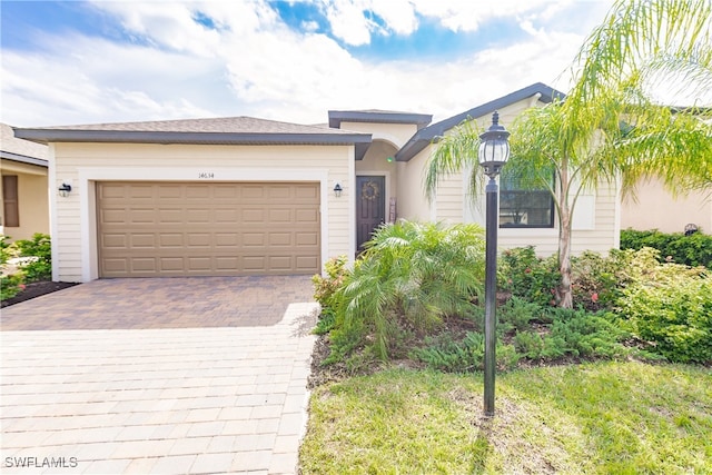 view of front of home with a garage