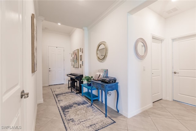 corridor featuring ornamental molding and light tile patterned flooring